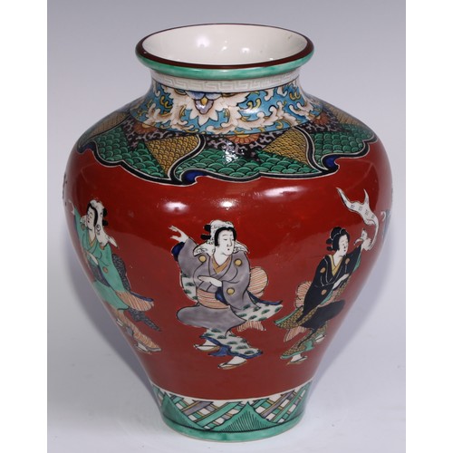 786 - A pair of Japanese ovoid vases, painted in polychrome with figures on a cinnabar ground, 26cm high, ... 