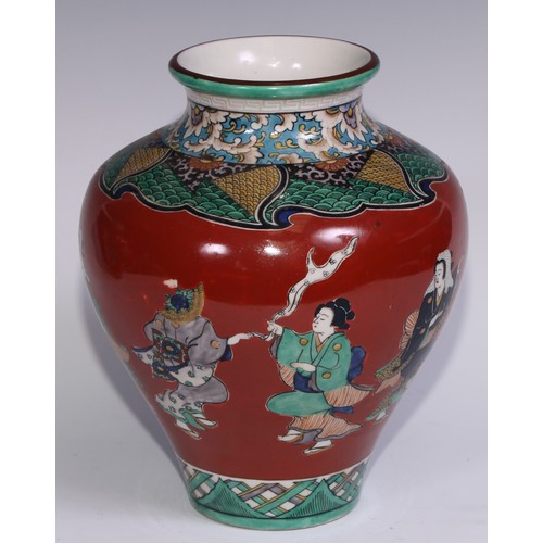 786 - A pair of Japanese ovoid vases, painted in polychrome with figures on a cinnabar ground, 26cm high, ... 