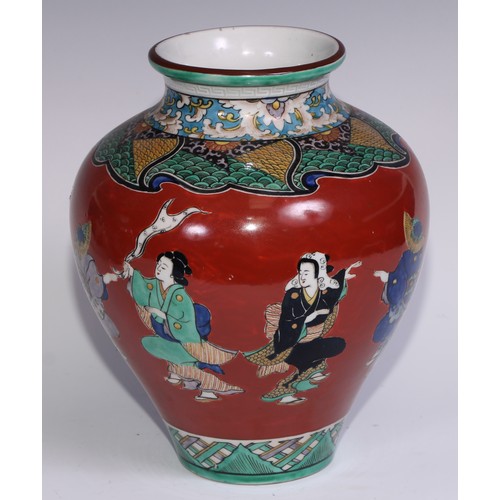 786 - A pair of Japanese ovoid vases, painted in polychrome with figures on a cinnabar ground, 26cm high, ... 