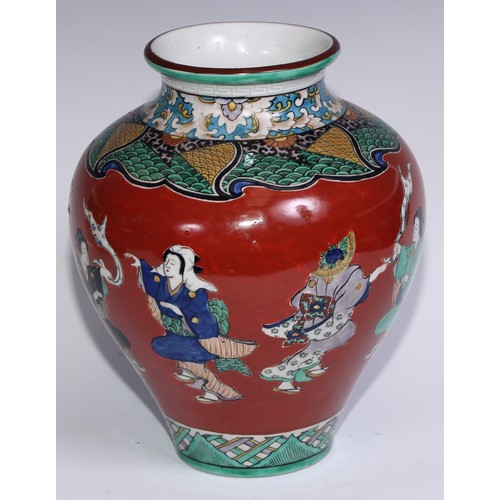 786 - A pair of Japanese ovoid vases, painted in polychrome with figures on a cinnabar ground, 26cm high, ... 