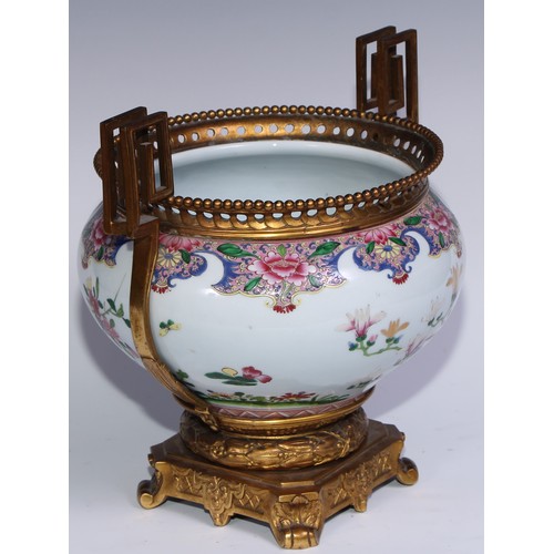 795 - An ormolu mounted Chinese ovoid jardiniere, painted in polychrome enamels in the famille rose palett... 