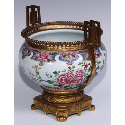 795 - An ormolu mounted Chinese ovoid jardiniere, painted in polychrome enamels in the famille rose palett... 