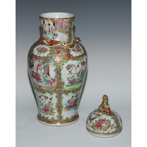 777 - A pair of Cantonese baluster vases and covers, painted in the famille rose palette with figures, bir... 