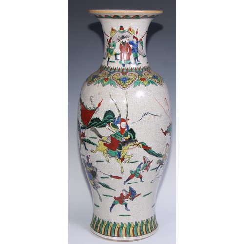 772 - A large Chinese crackle glaze ovoid vase, painted in polychrome with a battle scene, lappet border t... 