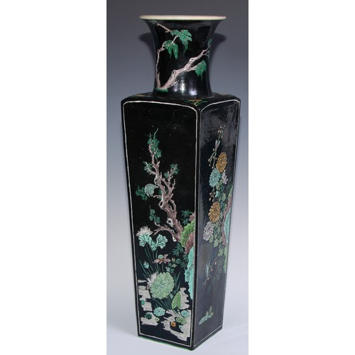 773 - A large Chinese famille noir tapered slab-sided vase, painted in polychrome enamels with panels of b... 