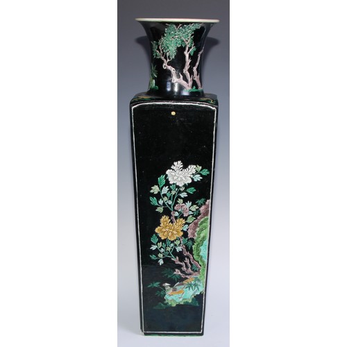 773 - A large Chinese famille noir tapered slab-sided vase, painted in polychrome enamels with panels of b... 