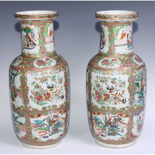 778 - A pair of Cantonese famille rose roleau vases, painted with Chinese figures, butterflies, flowers an... 