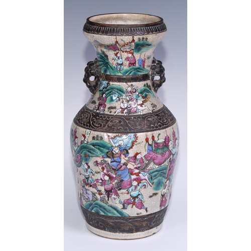 779 - A pair of Chinese crackle glazed ovoid vases, decorated in polychrome enamels with battle scenes, mo... 