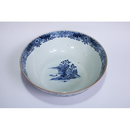 770 - A large 18th century Chinese punch bowl, decorated in tones of underglaze blue with figures on a bri... 