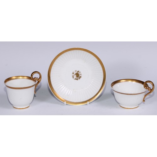 467 - A Swansea trio, comprising teacup, coffee cup and stand, each fluted and outlined in gilt, the sauce... 