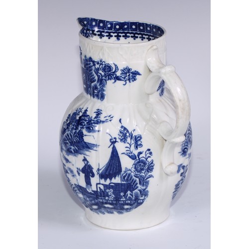 405 - A Caughley Fisherman and Cormorant pattern cabbage leaf moulded jug, mask spout, 22cm high, c.1785