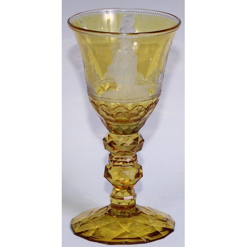 537 - A Bohemian amber-flashed glass goblet, wheel engraved with figures emblematic of the seasons, above ... 