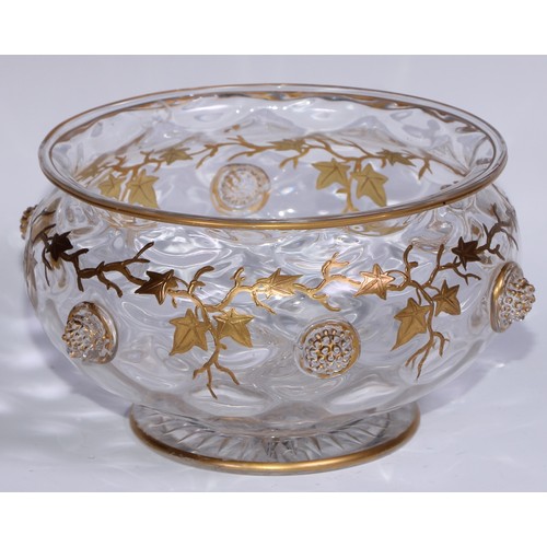 539 - A Continental Art Nouveau glass bowl, decorated in gilt with trailing vine terminating in applied gr... 