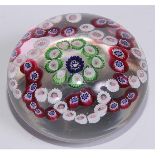 540 - A French millefiori domed paperweight, typically decorated with coloured canes, 8cm diam, c.1900