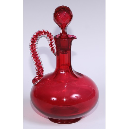 548 - A pair of Victorian cranberry glass compressed ovoid claret jugs, prismatic stoppers, rope-twist han... 