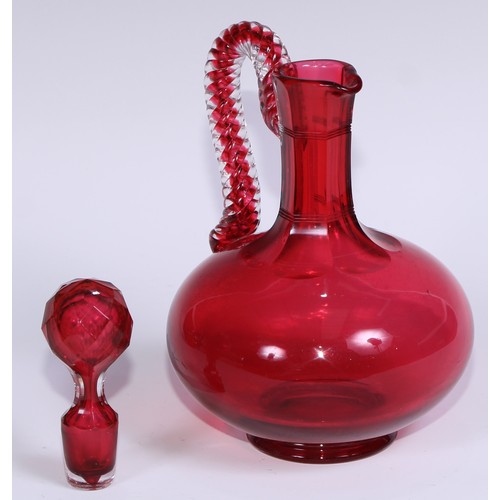 548 - A pair of Victorian cranberry glass compressed ovoid claret jugs, prismatic stoppers, rope-twist han... 