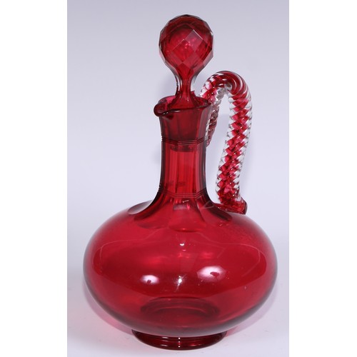 548 - A pair of Victorian cranberry glass compressed ovoid claret jugs, prismatic stoppers, rope-twist han... 