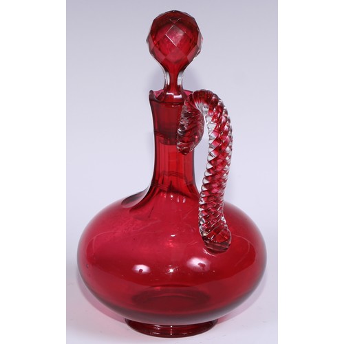 548 - A pair of Victorian cranberry glass compressed ovoid claret jugs, prismatic stoppers, rope-twist han... 