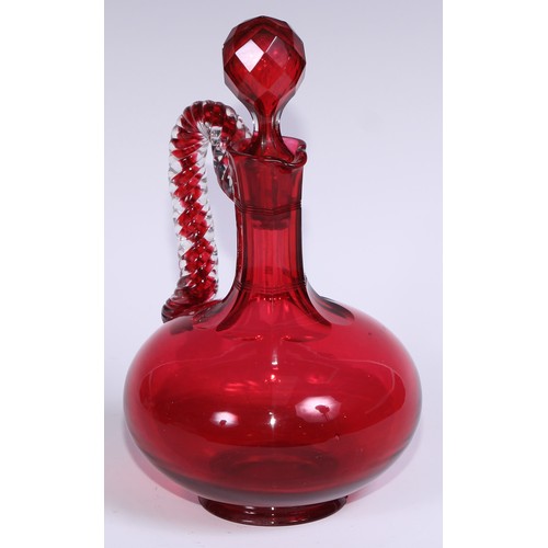 548 - A pair of Victorian cranberry glass compressed ovoid claret jugs, prismatic stoppers, rope-twist han... 