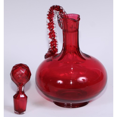 548 - A pair of Victorian cranberry glass compressed ovoid claret jugs, prismatic stoppers, rope-twist han... 