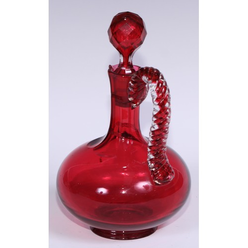 548 - A pair of Victorian cranberry glass compressed ovoid claret jugs, prismatic stoppers, rope-twist han... 