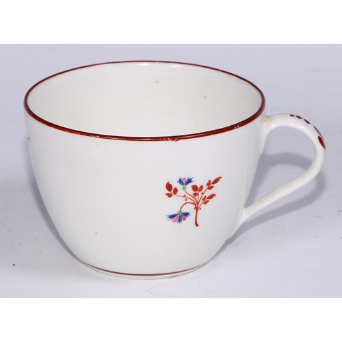 485 - A Pinxton tea cup and saucer, Pattern no.1, red sprig version, the saucer 14.5cm diam, c.1796 - 99