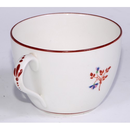 485 - A Pinxton tea cup and saucer, Pattern no.1, red sprig version, the saucer 14.5cm diam, c.1796 - 99