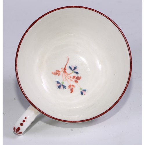 485 - A Pinxton tea cup and saucer, Pattern no.1, red sprig version, the saucer 14.5cm diam, c.1796 - 99