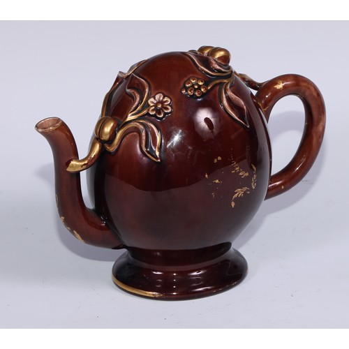 443 - A Brameld cadogan teapot, moulded and picked out in gilt with flowers and buds on a brown glazed gro... 