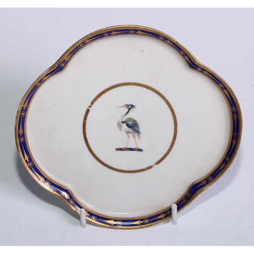 477 - A Derby lobed quatrefoil teapot stand, painted with a figure fishing in a landscape, the border gilt... 