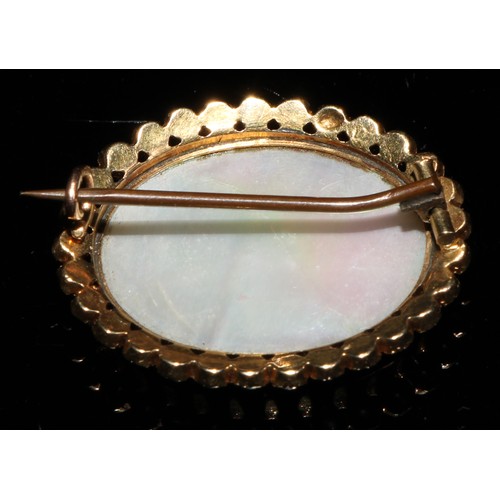 361 - A Victorian gold oval brooch, set with a Bilston type panel painted in sepia tones with a pair of pu... 