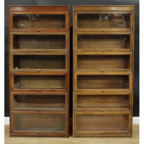 1367 - A near pair of mid-20th century government austerity regulation approved barrister's bookcases, each... 