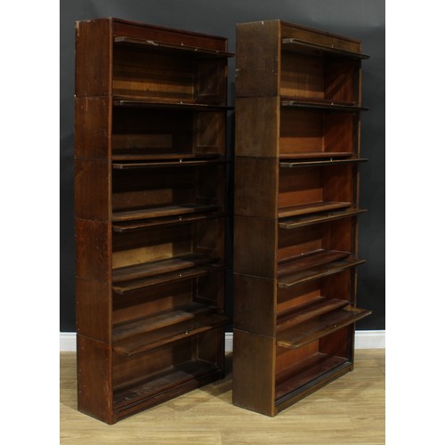 1367 - A near pair of mid-20th century government austerity regulation approved barrister's bookcases, each... 