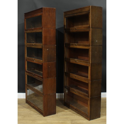 1367 - A near pair of mid-20th century government austerity regulation approved barrister's bookcases, each... 