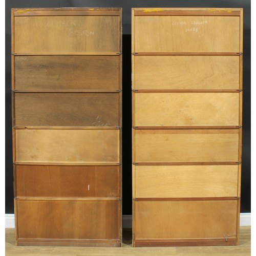 1367 - A near pair of mid-20th century government austerity regulation approved barrister's bookcases, each... 