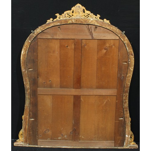 1308 - A 19th century giltwood overmantel chimney glass, plain mirror plate, the cresting applied with scro... 