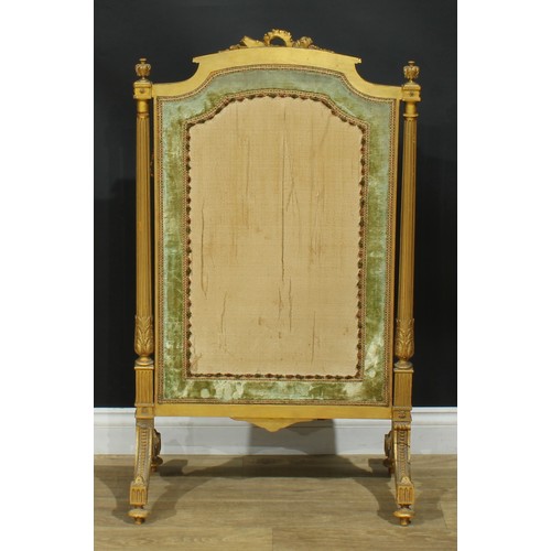 1354 - A Louis XVI Revival giltwood fire screen, arched cresting carved with a quiver of arrows crossed wit... 