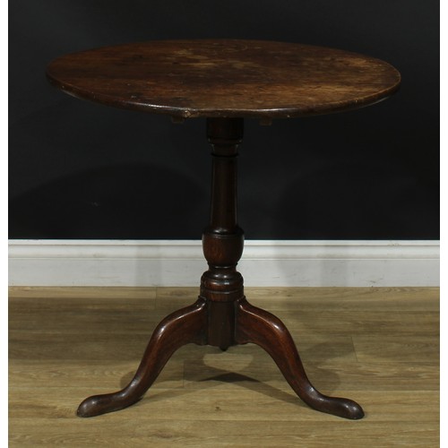 1171 - A George III oak tripod occasional table, circular tilting top, turned column, cabriole legs, pad fe... 