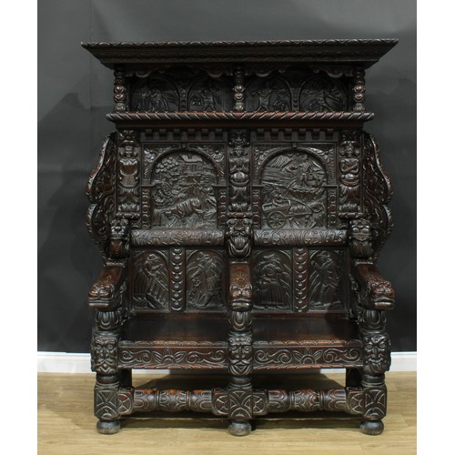 1280 - A large 17th century style oak settle, carved throughout with native folk scenes, grotesque masks an... 