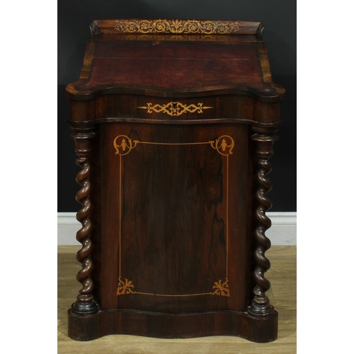 994 - A 19th century rosewood and marquetry serpentine Davenport desk, three quarter gallery above a slopi... 