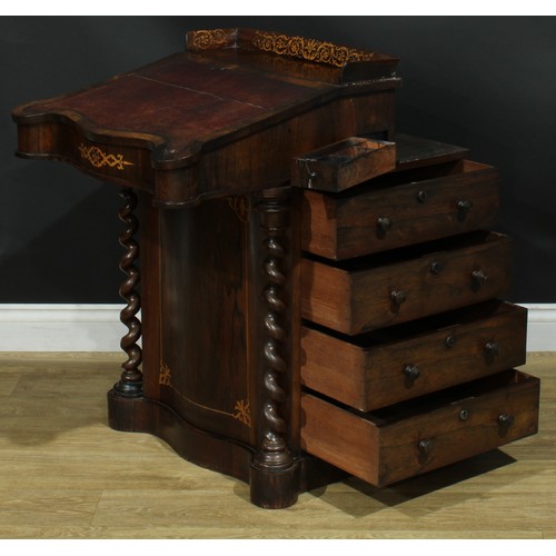 994 - A 19th century rosewood and marquetry serpentine Davenport desk, three quarter gallery above a slopi... 