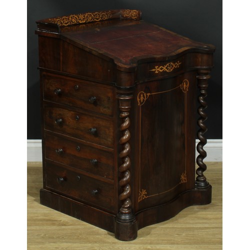 994 - A 19th century rosewood and marquetry serpentine Davenport desk, three quarter gallery above a slopi... 