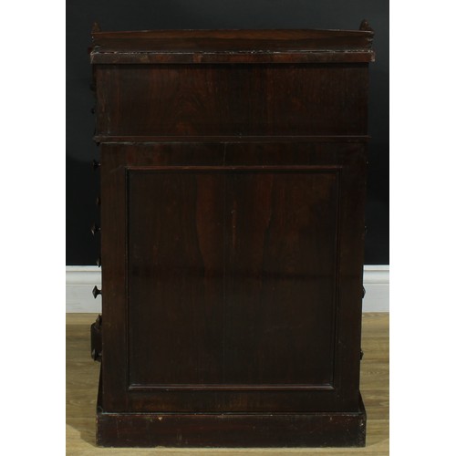 994 - A 19th century rosewood and marquetry serpentine Davenport desk, three quarter gallery above a slopi... 