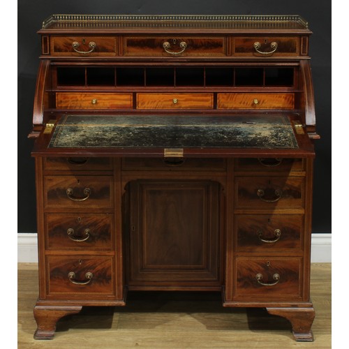 1334 - A late Victorian mahogany barrel-top kneehole desk, by Cooper & Holt (fl.1862-1889), badged, brass t... 