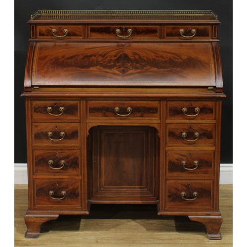 1334 - A late Victorian mahogany barrel-top kneehole desk, by Cooper & Holt (fl.1862-1889), badged, brass t... 