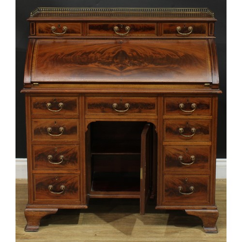 1334 - A late Victorian mahogany barrel-top kneehole desk, by Cooper & Holt (fl.1862-1889), badged, brass t... 