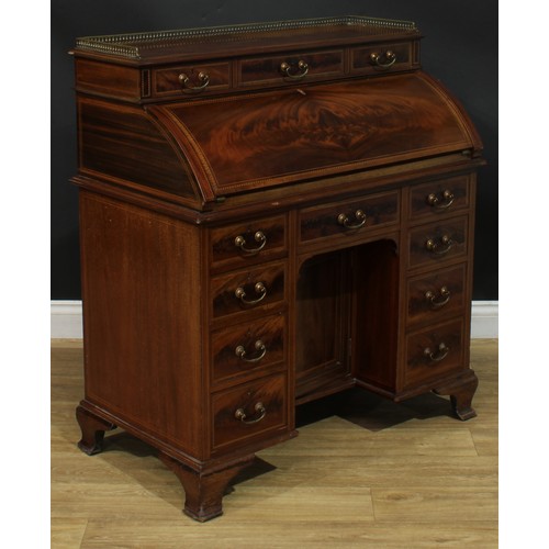 1334 - A late Victorian mahogany barrel-top kneehole desk, by Cooper & Holt (fl.1862-1889), badged, brass t... 