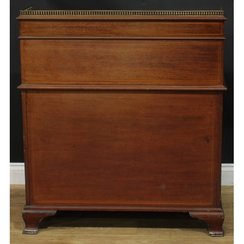 1334 - A late Victorian mahogany barrel-top kneehole desk, by Cooper & Holt (fl.1862-1889), badged, brass t... 