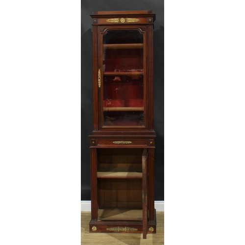 1372 - A pair of 19th century French Empire design gilt metal mounted mahogany pier bookcases, each with an... 