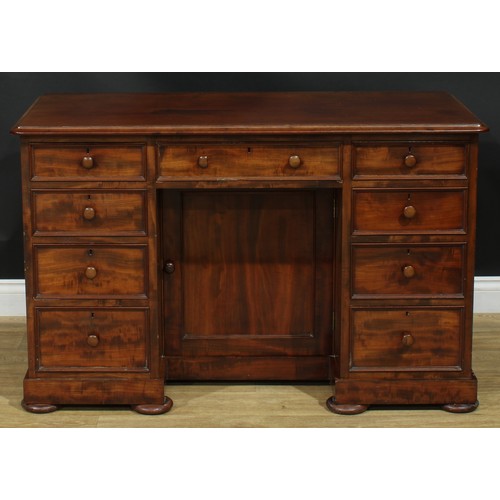 927 - A 19th century mahogany kneehole desk, rectangular top with moulded edge above an arrangement of dra... 